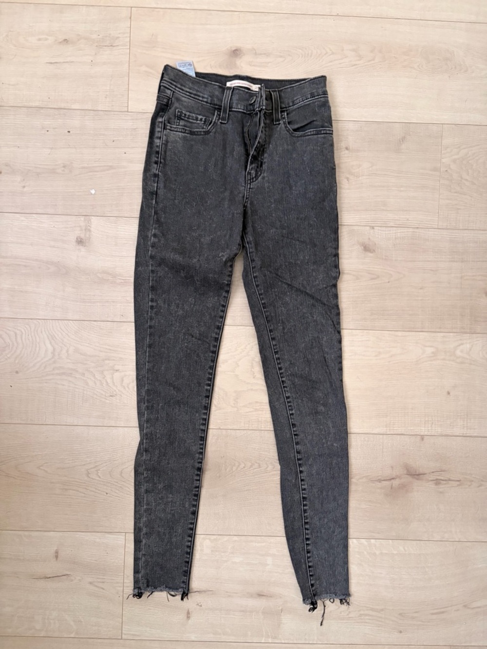 Levi's Washed Black Skinny Jeans with Raw Hem